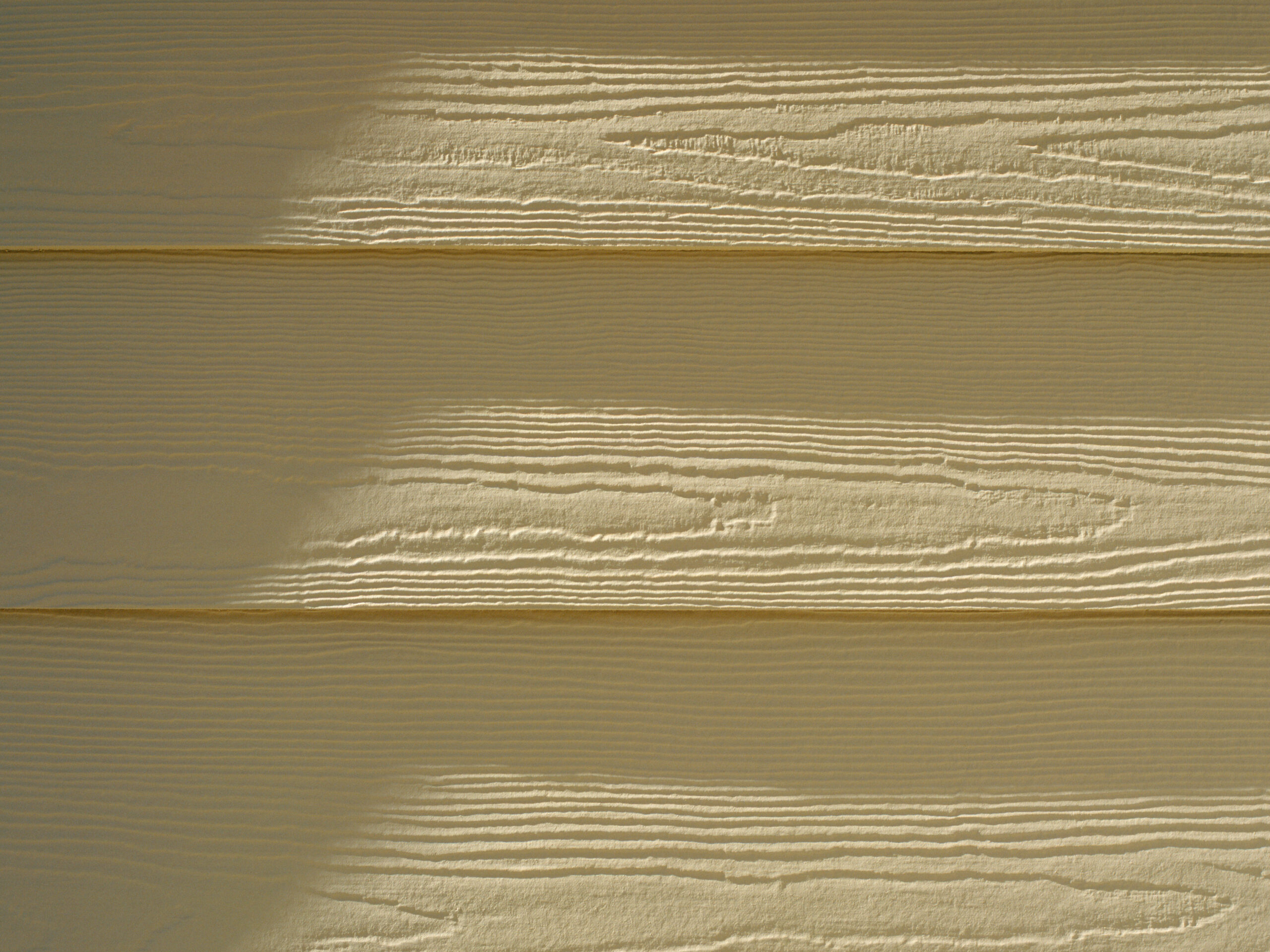 A close-up of some beige siding on a house.