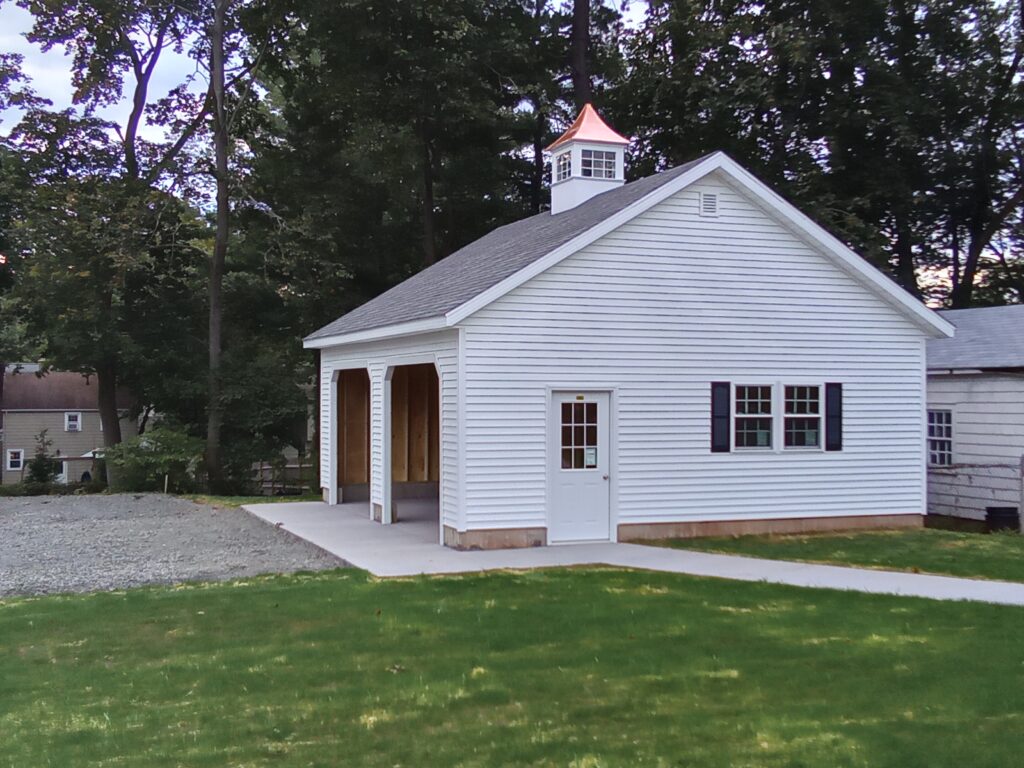 white 2 car garage with cupola