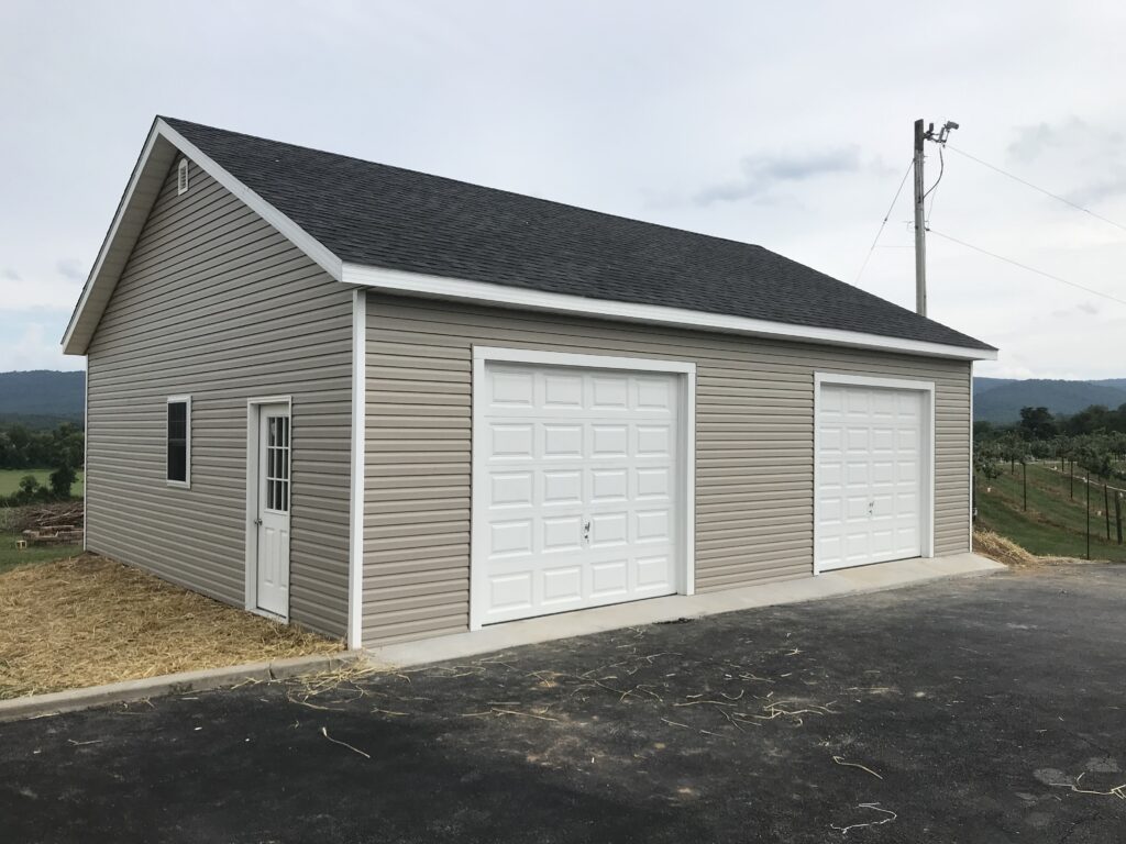 tan 2 car garage with side entrance